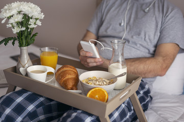 Man listening to music in bed