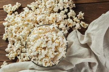 Salt popcorn on the wooden table