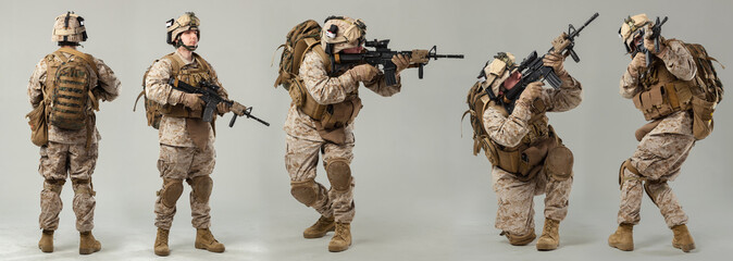 Soldier in camouflage holding rifle