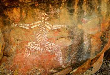 Ancient aboriginal painting of man art on huge rock stone in Kakadu park, northern territory,...