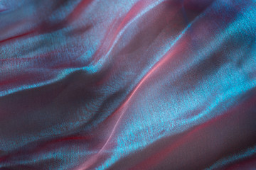 Obraz na płótnie Canvas twisted twirl of organza fabric multicolour texture