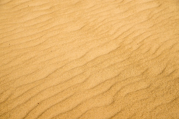 Sand of a beach with waves