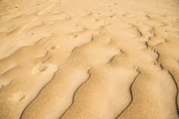 Sand of a beach with waves