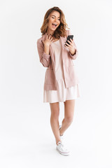 Young cute beautiful lady using mobile phone.