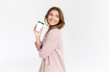 Cute lady standing isolated drinking coffee.