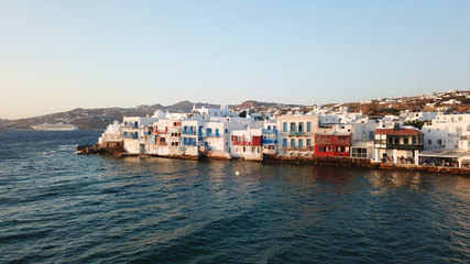 Fototapeta na wymiar Aerial drone, bird's eye view photo from iconic Little Venice at sunset with beautiful colours, Mykonos island, Cyclades, Greece