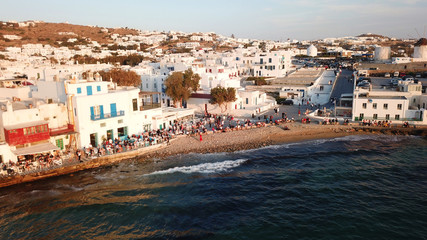 Aerial drone, bird's eye view photo from iconic Little Venice at sunset with beautiful colours, Mykonos island, Cyclades, Greece