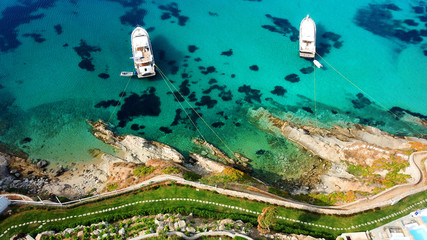 Aerial drone photo of famous turquoise clear water beach of Psarou in iconic island of Mykonos, Cyclades, Greece