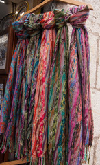 Many colorful headscarf hung as souvenirs