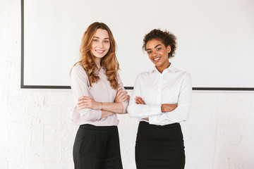 Two smiling young business women