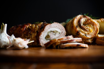 Roll of meat with various spices and herbs