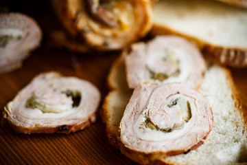 Roll of meat with various spices and herbs