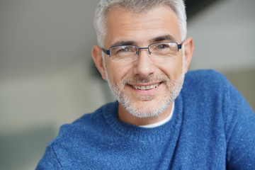 Middle-aged guy with eyeglasses and blue shirt