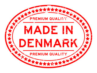 Grunge red premium quality made in Denmark oval rubber seal stamp on white background