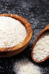 Portion of Psyllium Seeds on rustic dark background. Psyllium seed husks