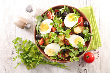 salad with egg, tomato, potato and olive