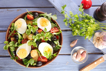 salad with egg, tomato, potato and olive