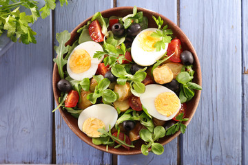 salad with egg, tomato, potato and olive