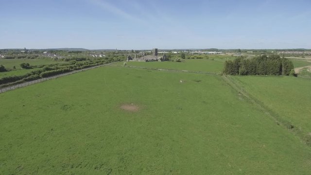 Beautiful scenic old ruins of Clare Abbey in County Clare, Ireland. Irish rural countryside with old Irish religious Abbey in decay.