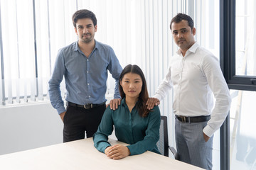 United professional team posing in modern office