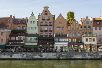 Ancient colored houses on the promenade of the river in Gdansk. Poland