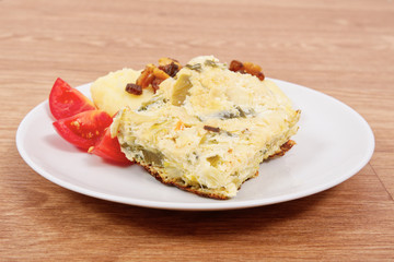 Baked leek with mashed potatoes on a table