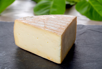 french Morbier cheese on a slate plate