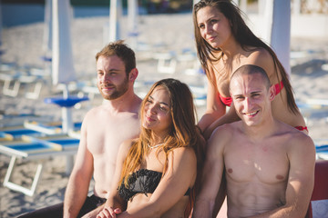 group of young multiethnic friends beach summer