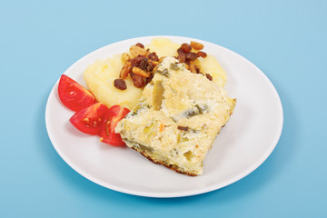 Baked leek with mashed potatoes on a blue
