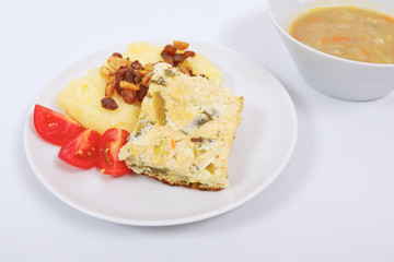 Baked leek with mashed potatoes on a white