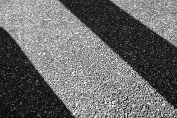 Fototapeta premium diagonal shadows on a aphalt road