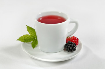 Raspberry and blackberry fresh tea on a white background