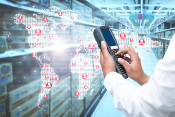 A worker scanning cargo with bluetooth barcode scan.
