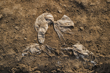 Polyethylene bag in the ground. Plastic bag. Bow. Environmental pollution