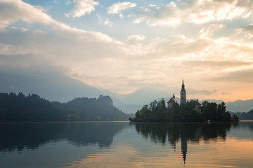 Fototapeta na wymiar Church on island in Lake Bled n sunrise, Slovenia