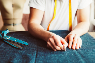 Tailor man working in his tailor shop, Tailoring, close up