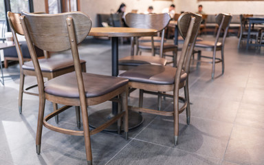 Fototapeta na wymiar Modern interior of coffee shop decorate with wooden furniture