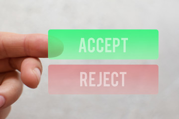 Finger pressing  green accept button on virtual touchscreen on light beige background. Decision...