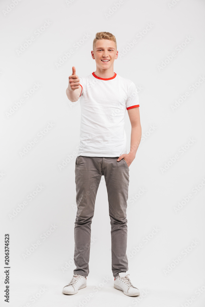 Poster Full length portrait of a smiling teenage boy