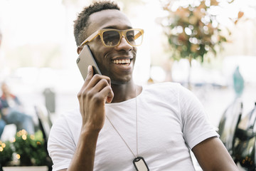 African man using mobile phone.