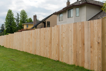Fototapeta na wymiar Cedar Wood Fencing along Home Backyard