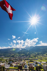 Swiss flag over the Alps in Switzerland