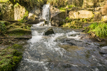 a waterfall in the natural park of 