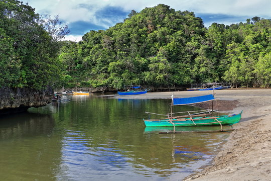 Bangka boats on sandy marshy stream-back of Sugar Beach. Sipalay-Philippines. 0479