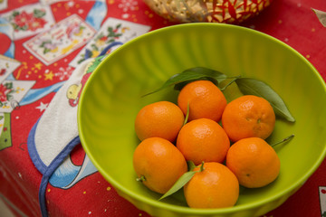 horizontal image of close-up of fruit basket with mandarins