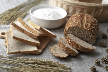 Deliciously decorated breads with ornamental items such as wheat flour and rice kernels.