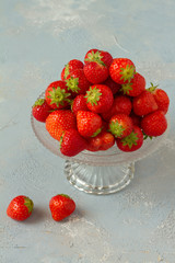 Fresh strawberries on a glas plate, plateau. Isolated.