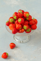 Fresh strawberries on a glas plate, plateau. Isolated.