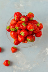 Fresh strawberries on a glas plate, plateau. Isolated.