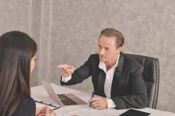 Business Concepts. Businesspeople is working in office. The Business people are serious. Businessmen, they talk and communicate. Business people work seriously in the office.